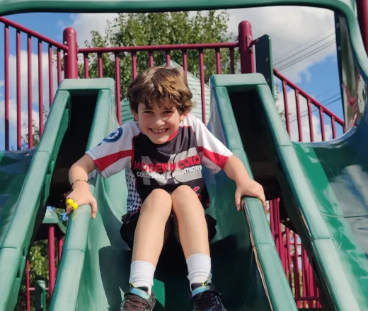 Boy on slide Tioga SACC